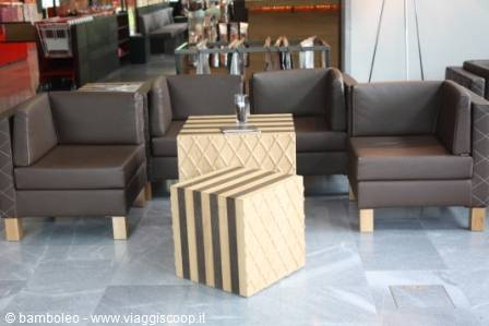 Brown sofas and patterned tables in a hotel lobby