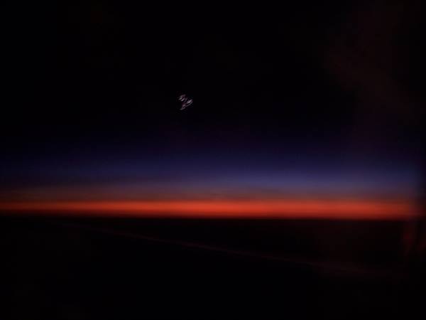 DAWN SEEN FROM THE PLANE