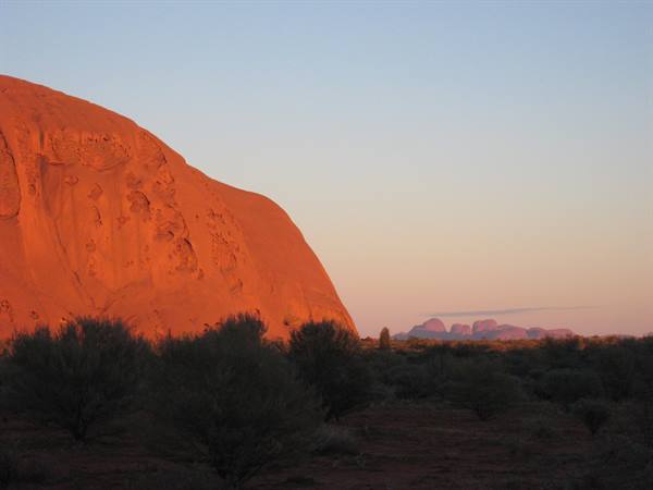 Uluru and, in the background, Kata Tjuta