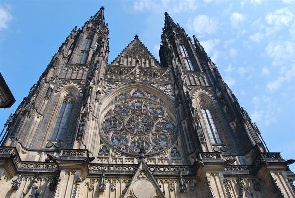 Gothic facade of St Vitus Cathedral in Prague, spires and stone rose window