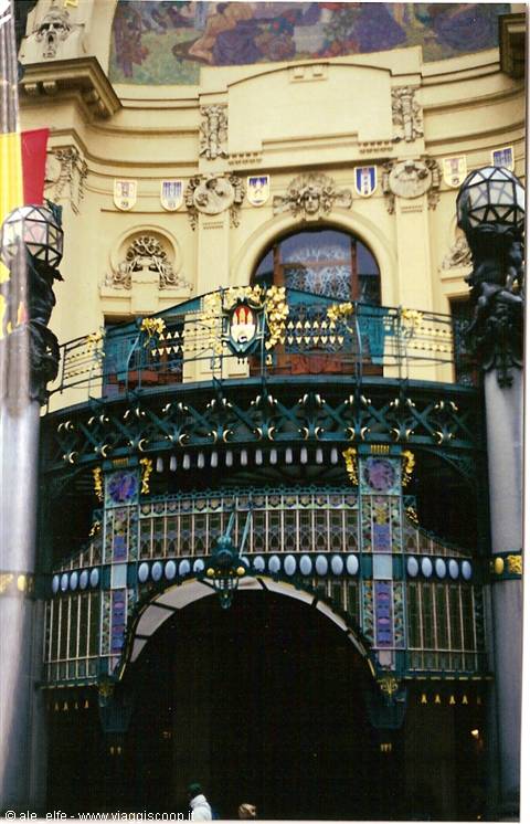 Art Nouveau facade of Prague's Municipal House, green wrought iron and golden decorations