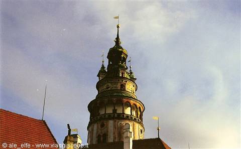 Renaissance tower of Český Krumlov castle against a cloudy sky