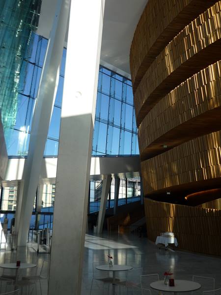 Oslo Opera House foyer: sweeping oak walls, glass facade, morning light
