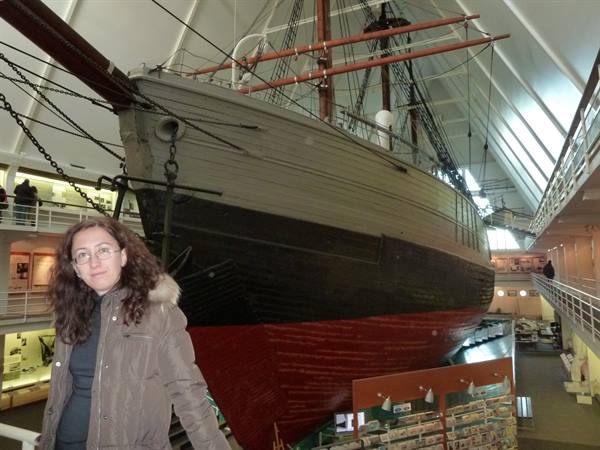 Woman beside the polar ship Fram at the Fram Museum in Oslo
