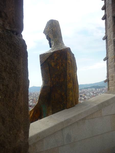 Bronze statue on the Sagrada Família tower overlooking Barcelona