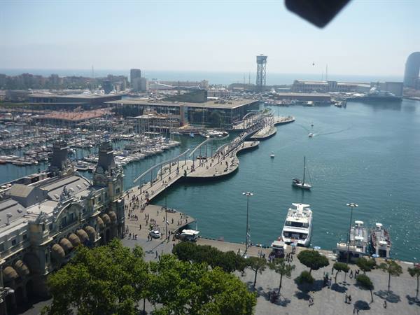 Barcelona's Port Vell: docked yachts, Rambla del Mar footbridge, Torre Jaume I