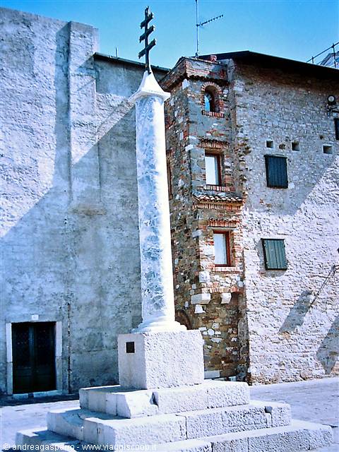 Marble column topped with iron cross on stone base, Piran
