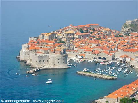 Dubrovnik old town: stone walls, red rooftops, harbor full of boats