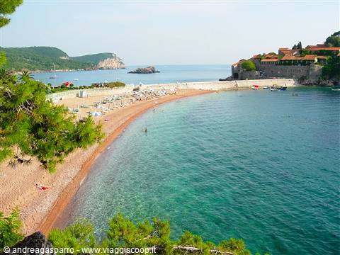Sveti Stefan beach, pink sand, turquoise sea, umbrellas and islet