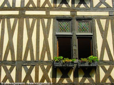 Half-timbered facade with crossed beams, wooden windows and flower boxes, Rennes
