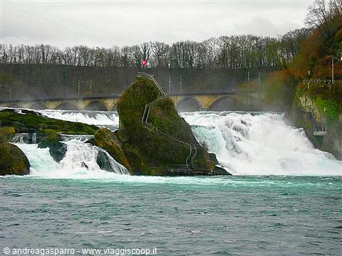 Rhine Falls at Schaffhausen, rocky outcrop with staircase amid rushing white water and arched bridge