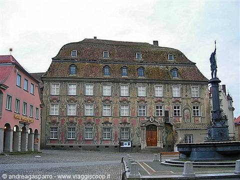 Lindau, old town hall with painted facade and fountain statue on the square