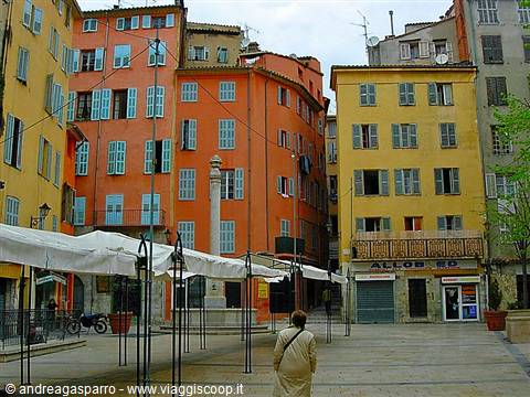 Square in Nice with ochre and orange houses, white market awnings