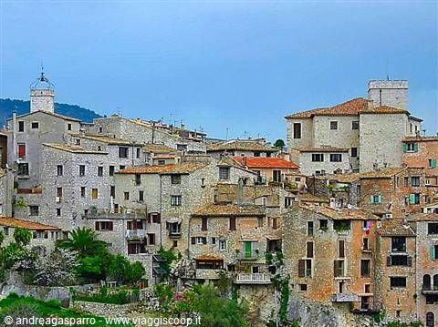 Medieval village of stone houses built on the rock, cloudy sky