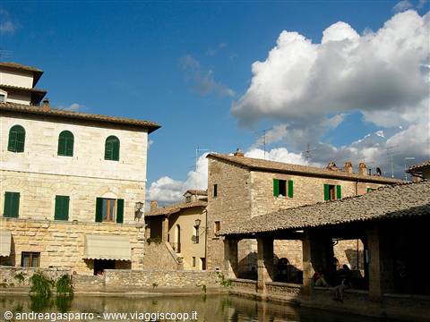 Bagno Vignoni, square with thermal water pool and stone buildings