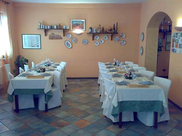 In the dining rooms of Ristorante Le Terre Rosse in Conzano