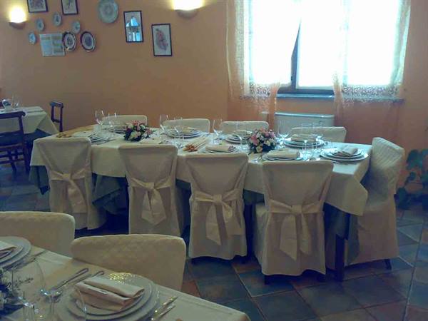 In the dining rooms of Ristorante Le Terre Rosse in Conzano