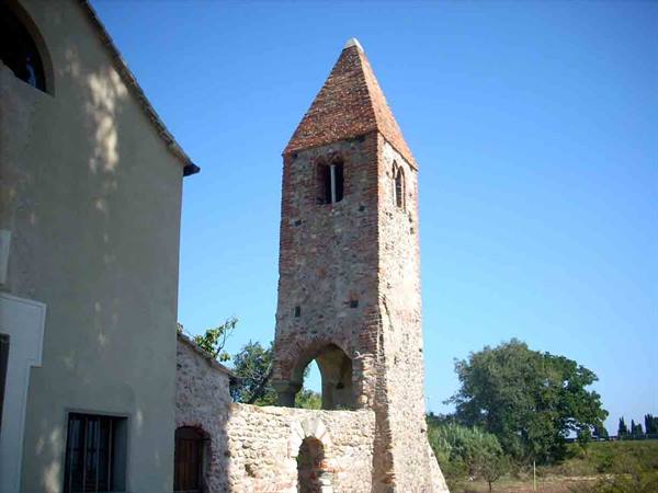 The ancient bell tower of the church of San Pietro in Carpignano