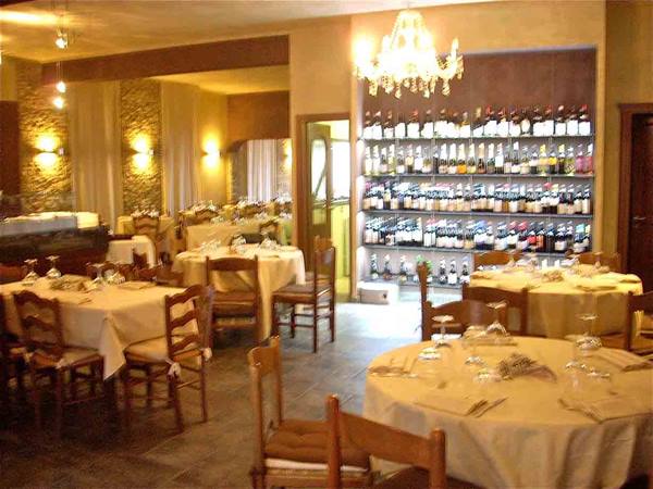 In the dining room of Osteria Pizzeria Per Bacco in La Morra