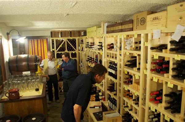 The very well-stocked wine shop of Antica Trattoria della Posta