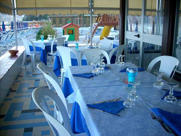 The dining room of Ristorante Cantinone Mare, with the children's play area nearby