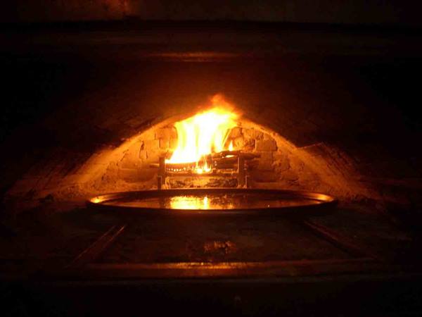 The wood-fired oven of Trattoria Mazzini where the legendary farinate are baked