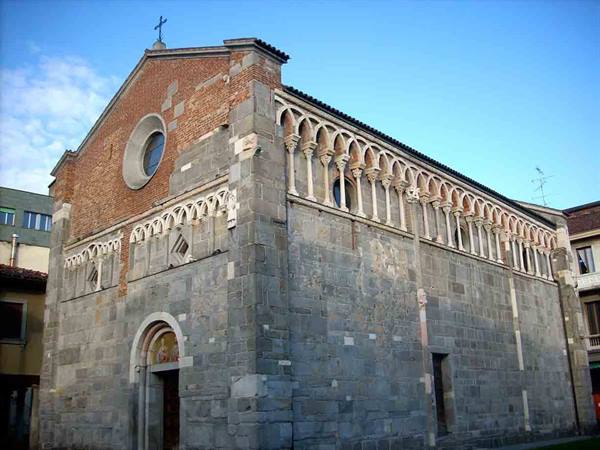 Romanesque stone church with brick facade and hanging arches, Pisa