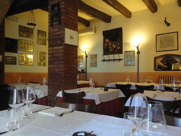 In the characteristic dining room of Trattoria del Borgo
