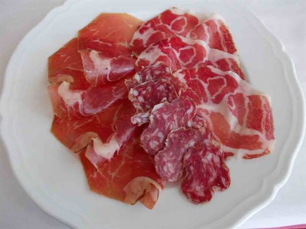 Mixed local cured meats: coppa, salami and P.D.O. pancetta