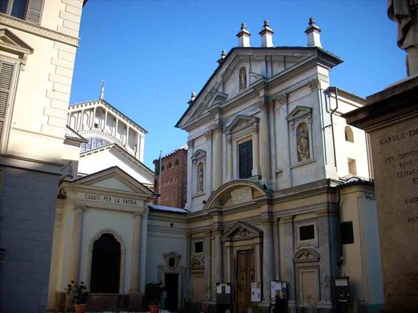 Baroque church of Santa Croce beside Turin Cathedral under sunny light