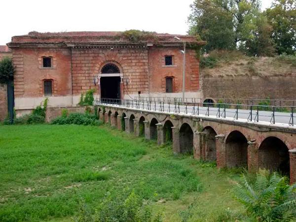 Brick arched bridge leading to a fortress gate