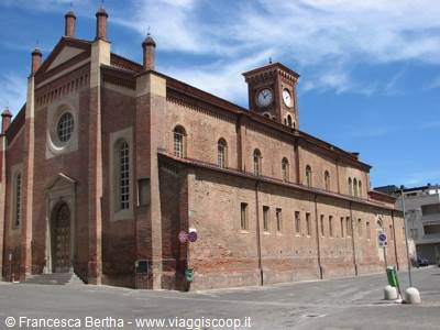 Brick church with clock tower, blue sky, empty street