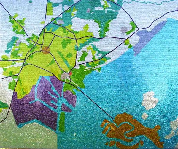 Colorful mosaic of painted maps in green, blue and purple tones