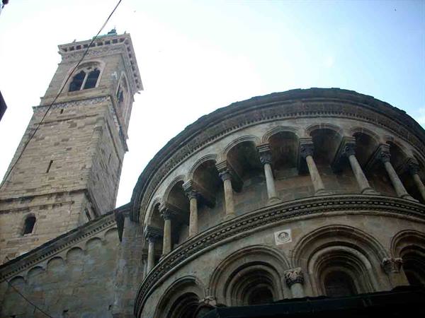 Romanesque apse with colonnaded gallery and stone bell tower in Bergamo