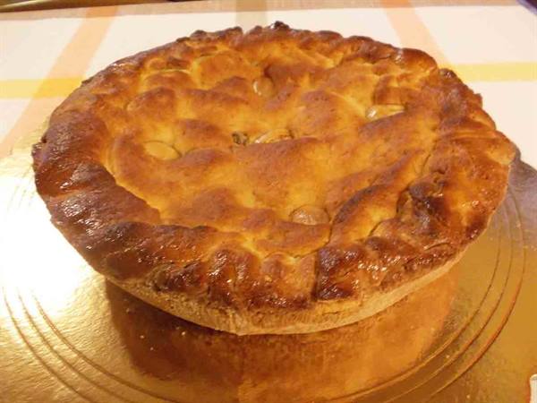 golden homemade pie fresh from the oven on gold tray