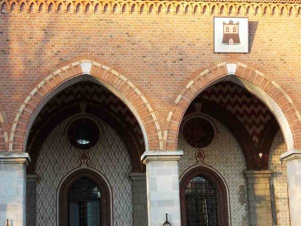 Brick loggia with pointed arches and painted coat of arms, Castello del Valentino, Turin