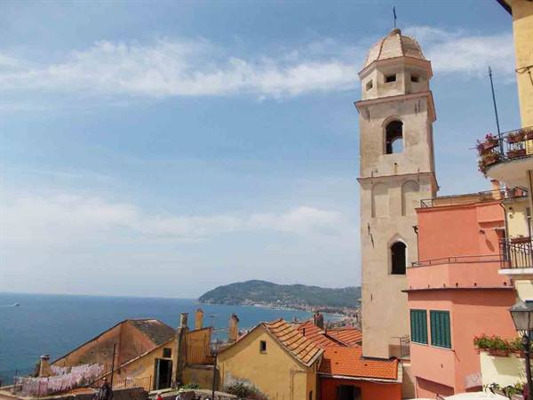 Bell tower and colorful houses above the sea, Ligurian coast