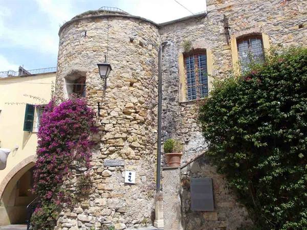 Medieval stone tower with blooming bougainvillea in Sestri Levante old town