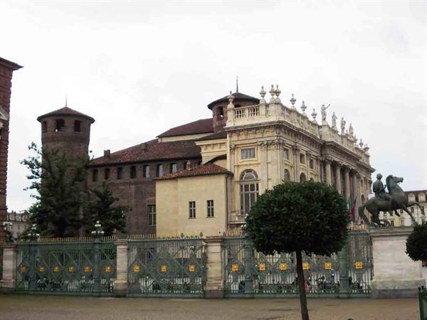 Palazzo Madama in Turin, medieval tower and baroque facade behind the green gate