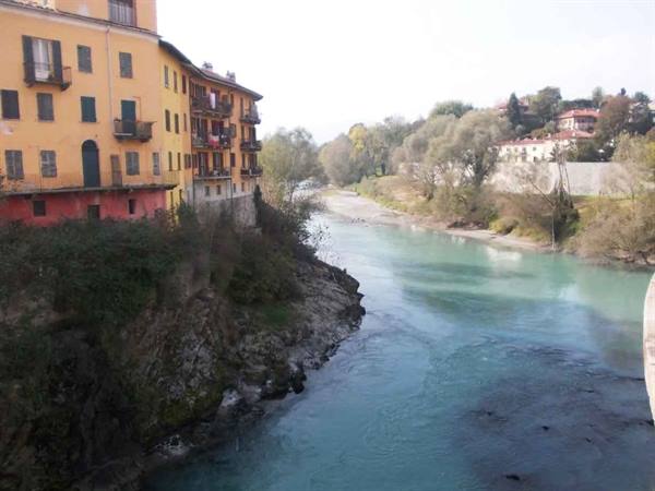 Yellow and red houses above the Dora Baltea river in Ivrea