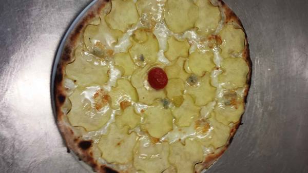 White pizza topped with thin potato slices and cherry tomato, on metal tray