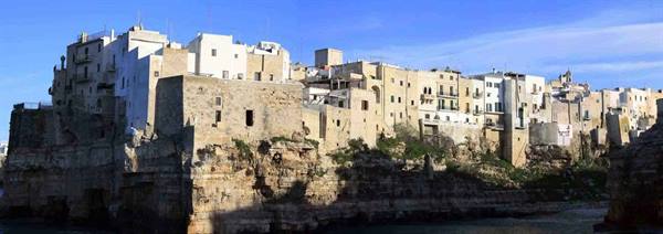 White houses and stone bastions above the cliffs in Polignano a Mare
