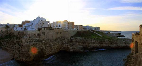 White houses on limestone cliffs above the sea, Polignano a Mare