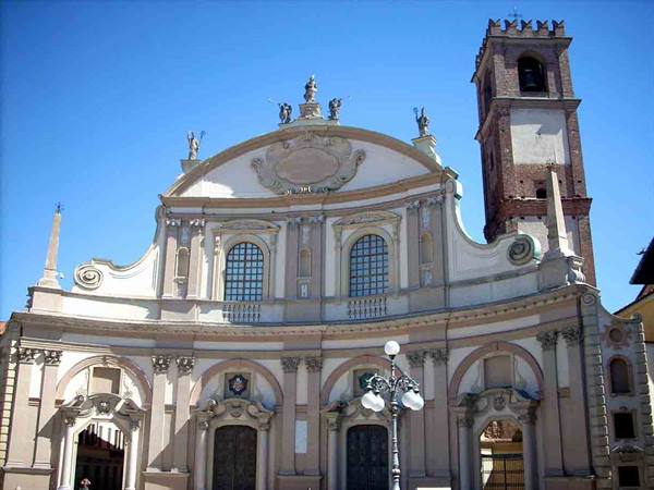 Baroque facade of San Giovanni church in Vigevano with brick bell tower