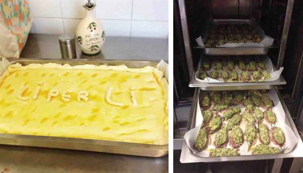 Savory pie reading L'PER L'I beside trays of stuffed eggplants in the oven
