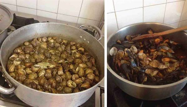 Aluminum pots on the stove with snails and mussels cooking