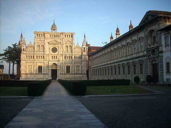 Marble facade of Certosa di Pavia lit by morning sun
