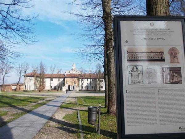 Information panel with map and history in front of Certosa di Pavia