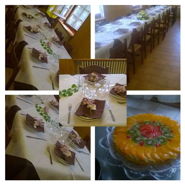 Banquet table set with white tablecloth and fruit tart decorated with peaches