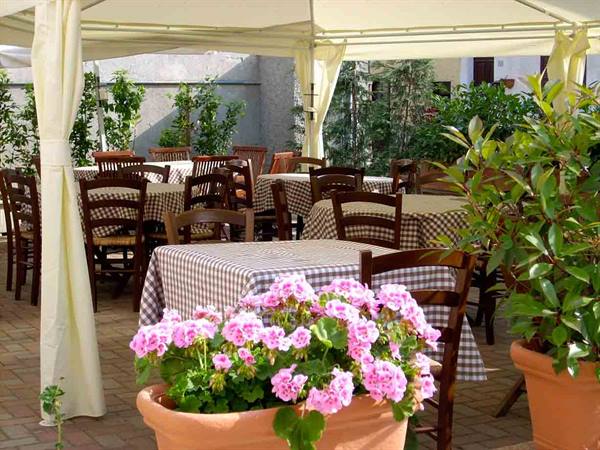 The flowered outdoor area of Locanda San Rocco